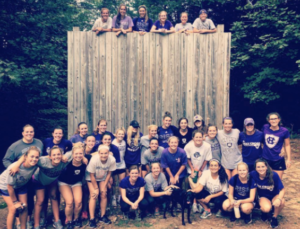 Women's Lacrosse outdoor activity: lifting each other up over an 18ft. wall! Photo provided by Madison Smith.