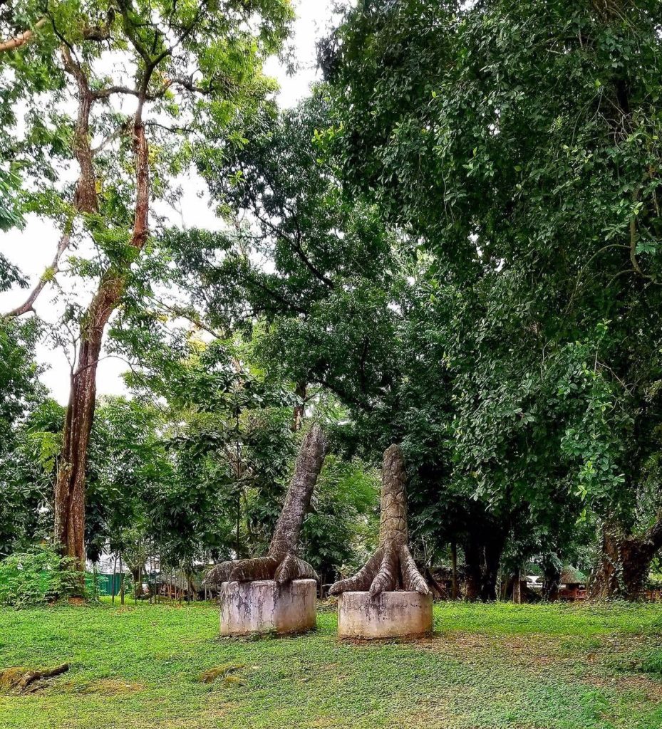 Two bird feet statues side by side at University of the Philippines Academic Oval