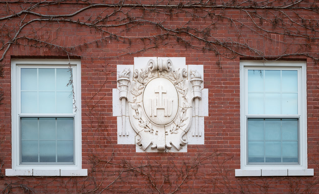 Two closed windows from outside Alumni Hall