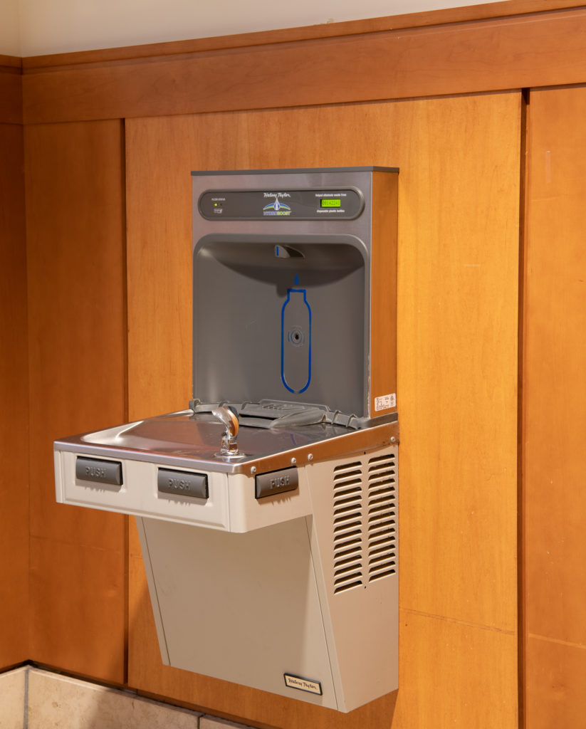 Hydration station built into wooden wall